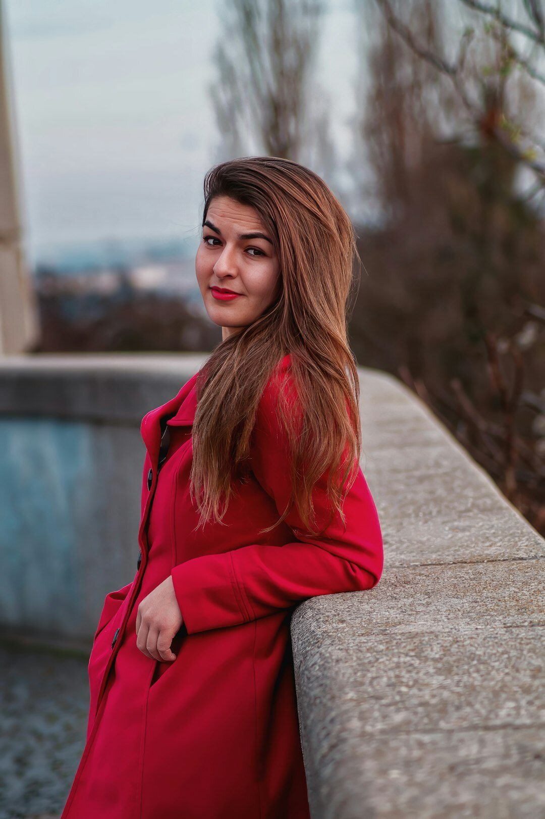 Portrait of a young Czech woman smiling in a home kitchen