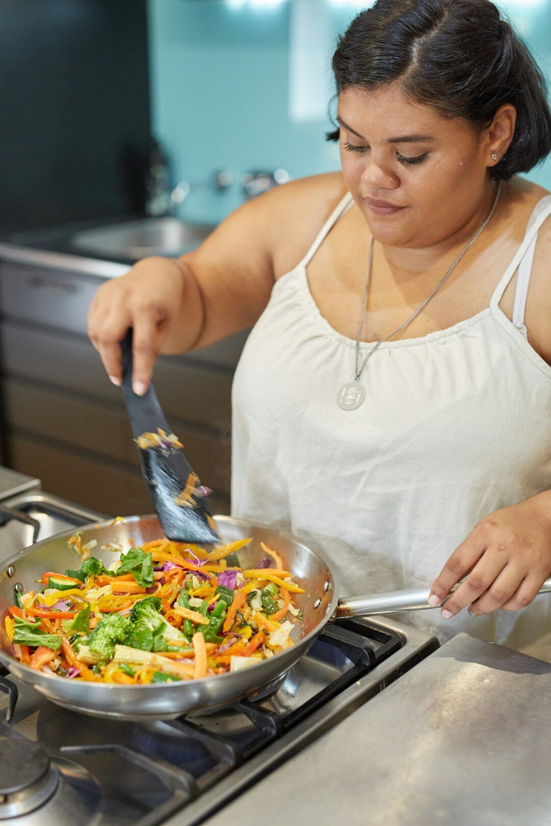woman cooking with leftovers