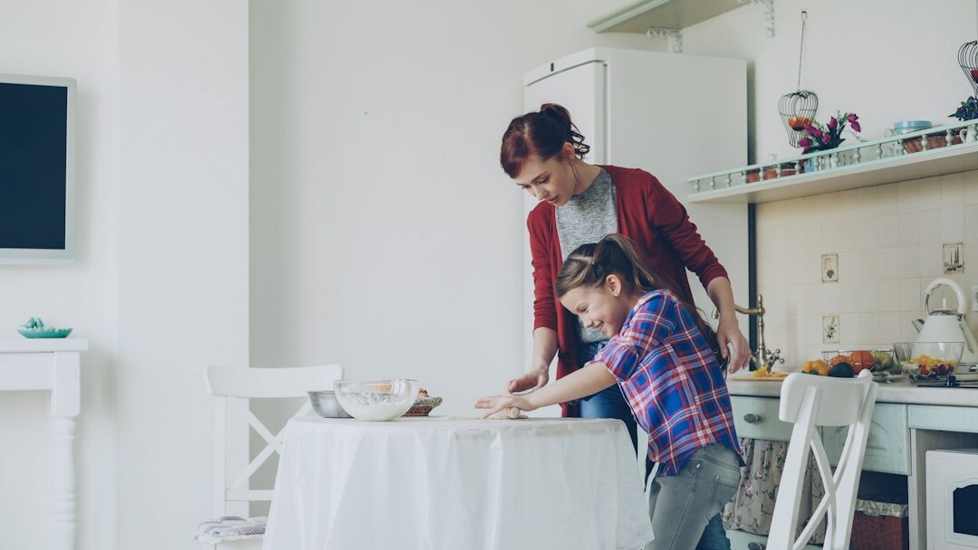 Family preparing homemade food together in a bright kitchen