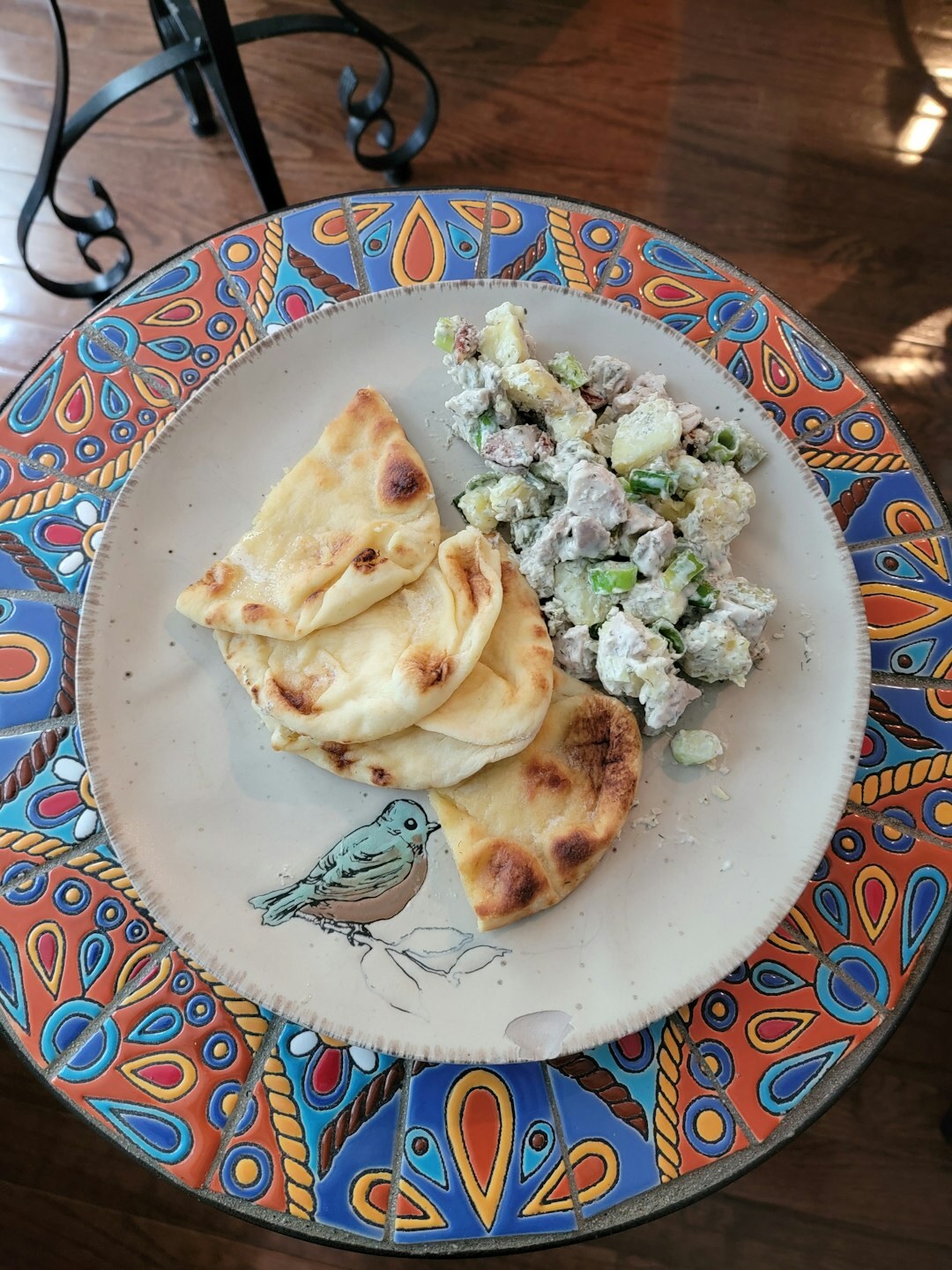 Simple homemade lunch with fried food and potato salad on a plate