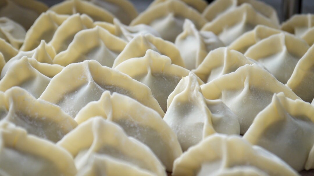 Close up of Czech svickova beef sauce dish with dumplings and cranberry